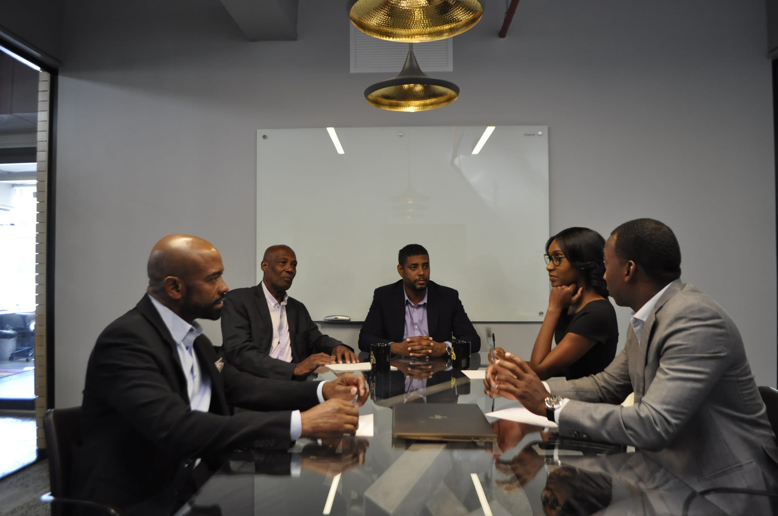 The Shields Industries team working together at a conference table